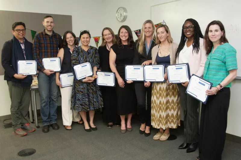 Graduates of the Global Nursing Certificate Program stand together holding their certificates.