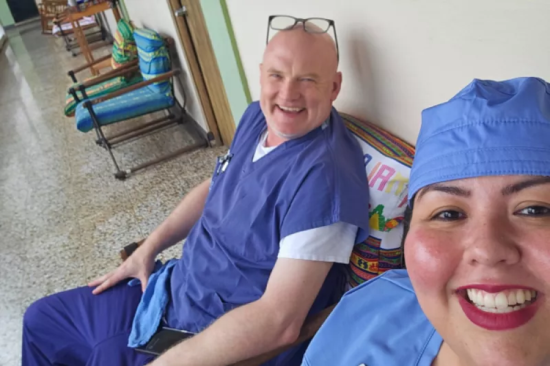 Selfie of two travel award recipients in a clinic in Guatemala.