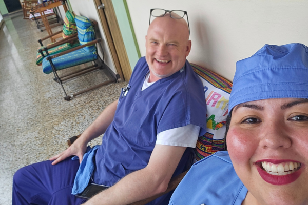 Roxana Benavides and Neil Wiegand pause for a selfie in the clinic in Guatemala.